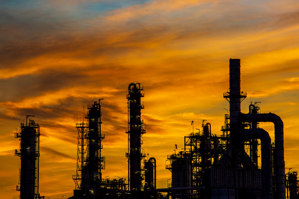 Oil refineryies with a sunset background