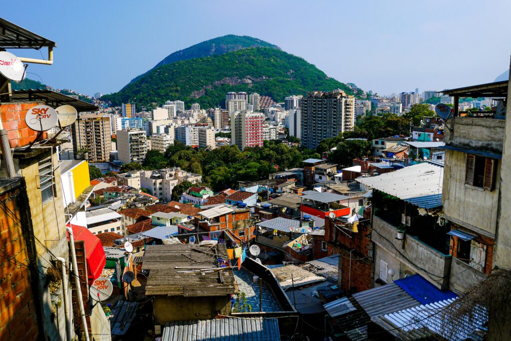 A favela in Brazil with a view of skyscrapers