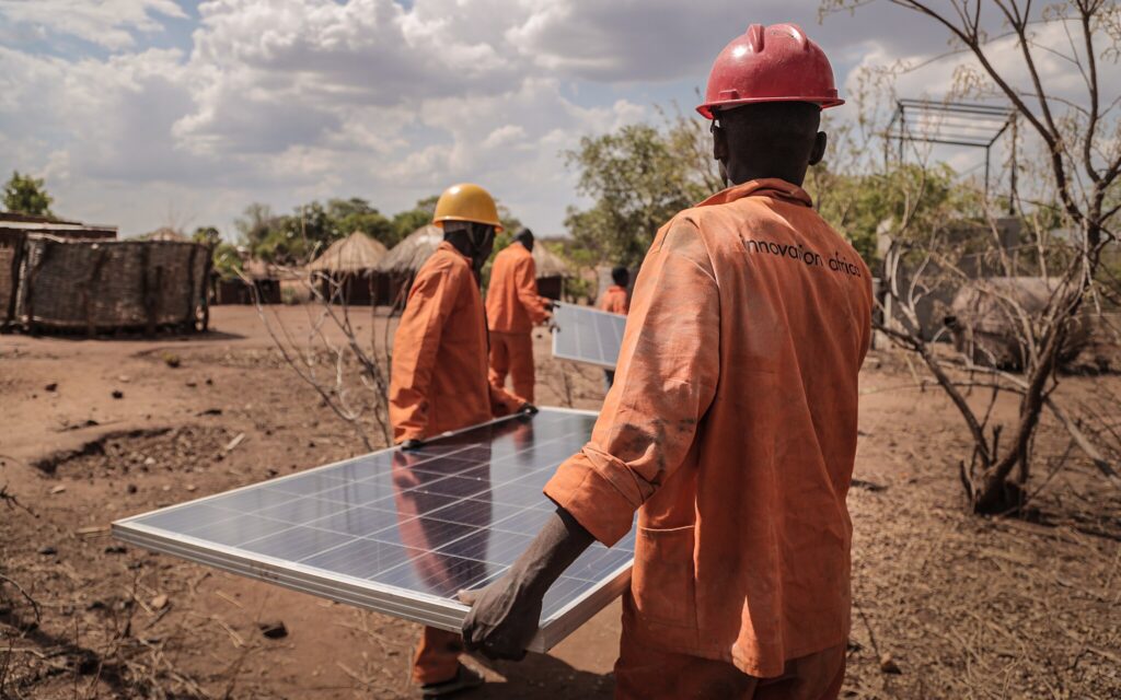 People installing a solar panel