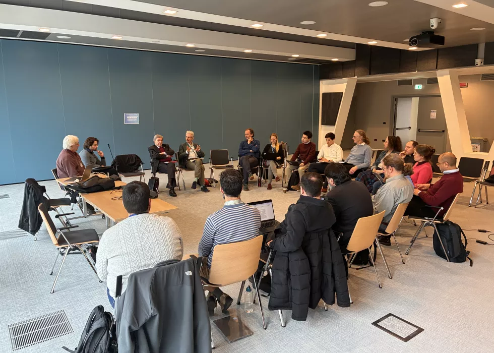 people in discussion around a table